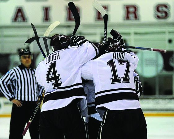 Senior defenseman Kevin Lough and junior forward Emilio Audi celebrate a goal during a home game at Starr Rink this past weekend.