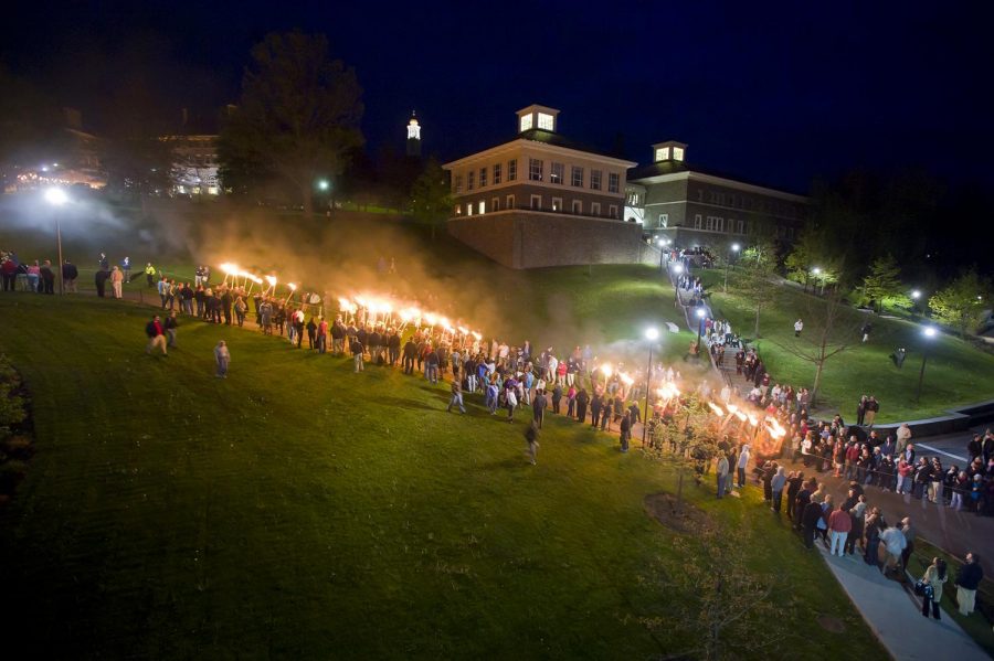 The senior graduating class of 2010 walks down the hill carrying torches in the traditional Torchlight Ceremony the night before Commencement. The seniors walk down the hill and circle Taylor Lake, whereupon they sing the Alma Mater. The ceremony began in 1930 by Frank M. Williams, class of 1895 and president of the Alumni Corporation, and Bernard P. Taylor, class of 1924 and secretary of the college.