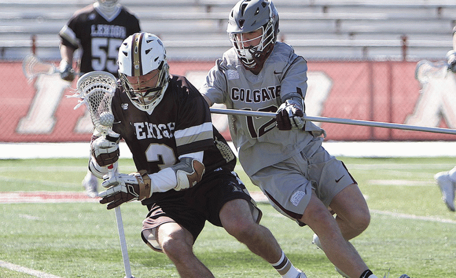 First-year longstick midfielder Parker Baddley plays tight defense against a national powerhouse in the Lehigh Mountain Hawks offense during an 11-5 loss at home this past weekend. 