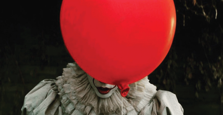 The terrifying Pennywise poses with his classic red balloon. If you are a fan of horror, the anticipated It is not to be missed.