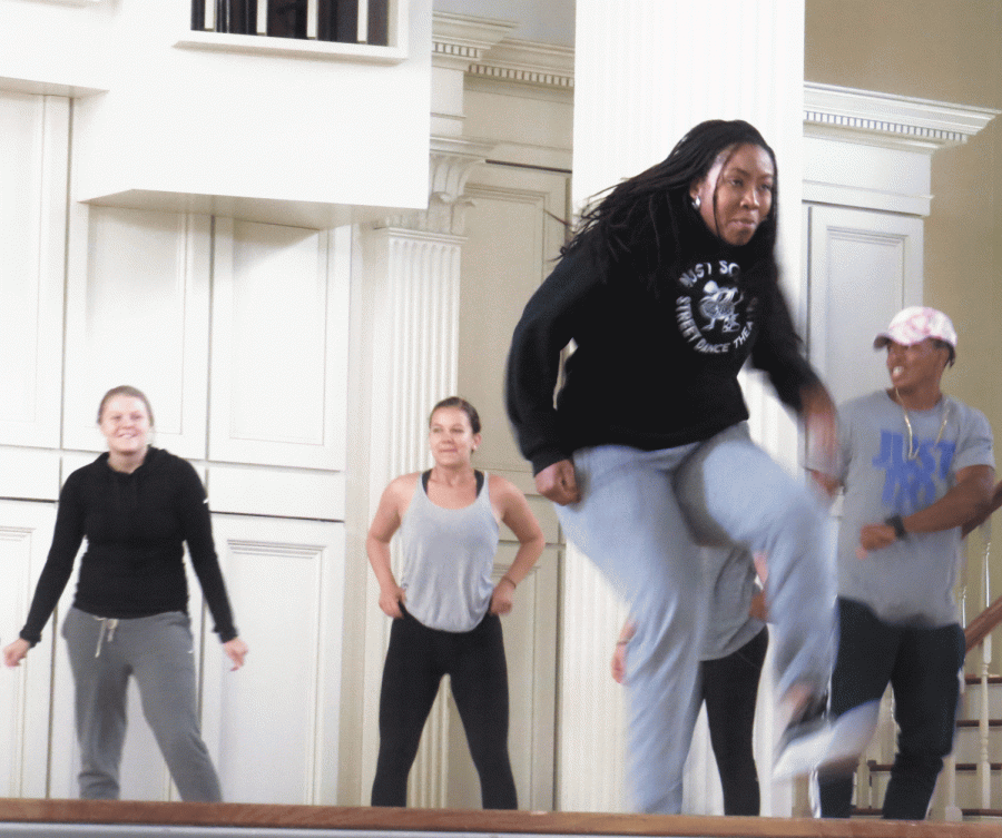 Dinita “Queen Di” Clark demonstrates hip-hop moves.