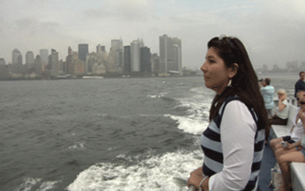 Tarbell on a New York City ferry, overlooking the Manhattan skyline that her ancestors helped build.