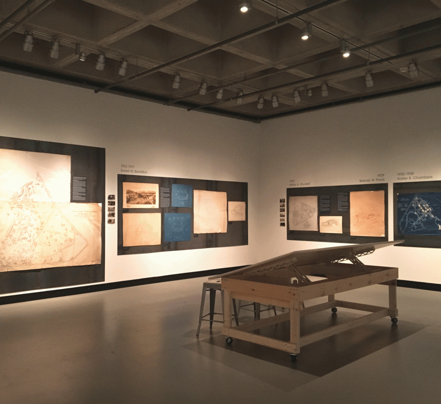  The Clifford Art Gallery museum exhibit features maps of campus.