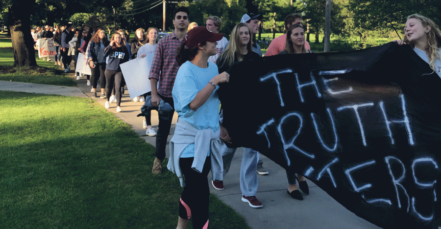 Colgate community marches in response to allegations surrounding Brett Kavanaugh in a “Walk for the Truth” on Friday, September 28. The walk started at the Village Green and continued down Broad Street toward campus.