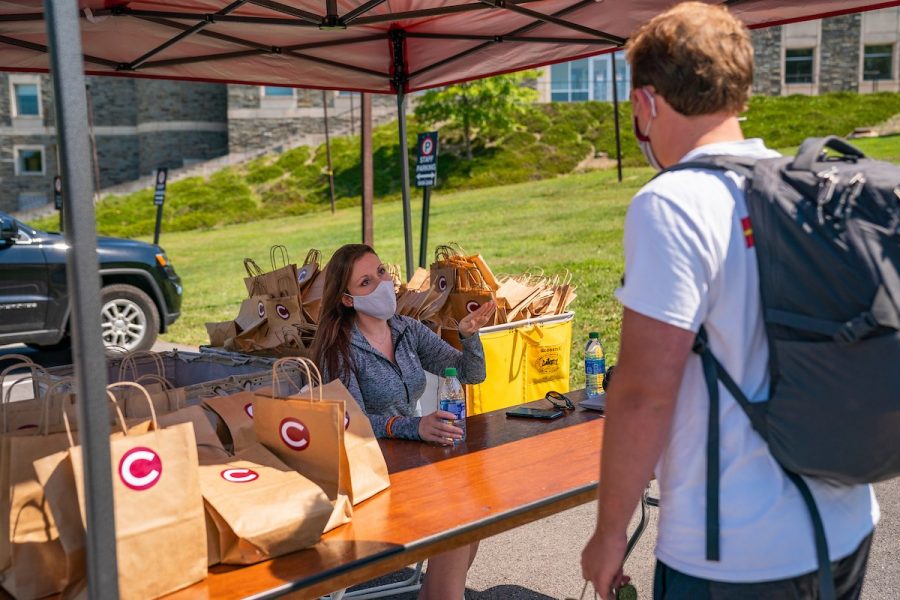 A first-year student checks in after arriving to campus. All students picked up a welcome bag including two Colgate masks, a thermometer and hand sanitizer before beginning the mandatory quarantine until Sept. 8.
