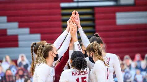 HUDDLING UP: The Colgate Women’s Volleyball team comes together amidst a close game to NCAA powerhouse UNLV, a top team in the country.