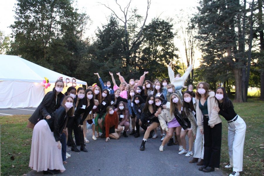 REWORKING RECRUITMENT: Current members of Gamma Phi Beta Sorority gather in masks to welcome potential new members.