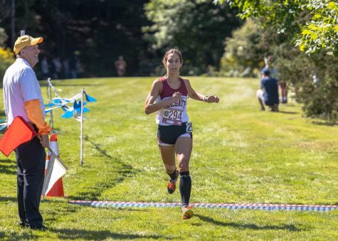 RUNNING THROUGH THE FINISH LINE: Junior Captain Sophia Manners finished first for Colgate and 15th overall at the Patriot League Championships.