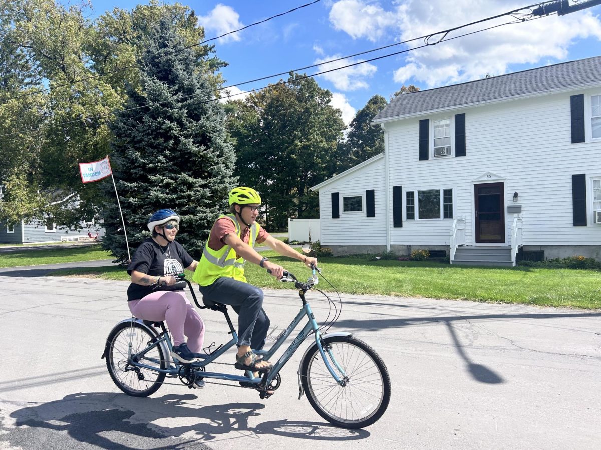 IT TAKES TWO: Geography Professor Mike Loranty (captain) and his partner Ash (stoker) start their 5-mile ride around Hamilton. 
